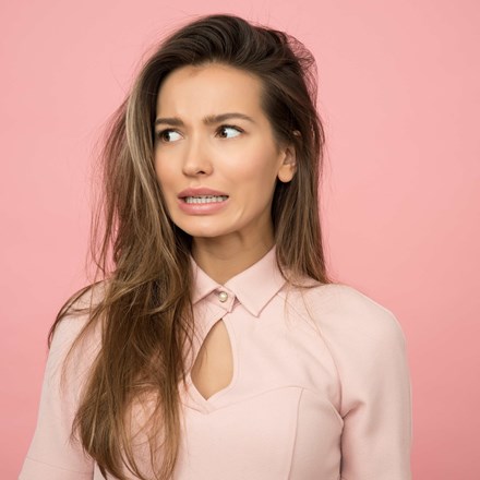 Woman Concerned and Wearing Pink Top