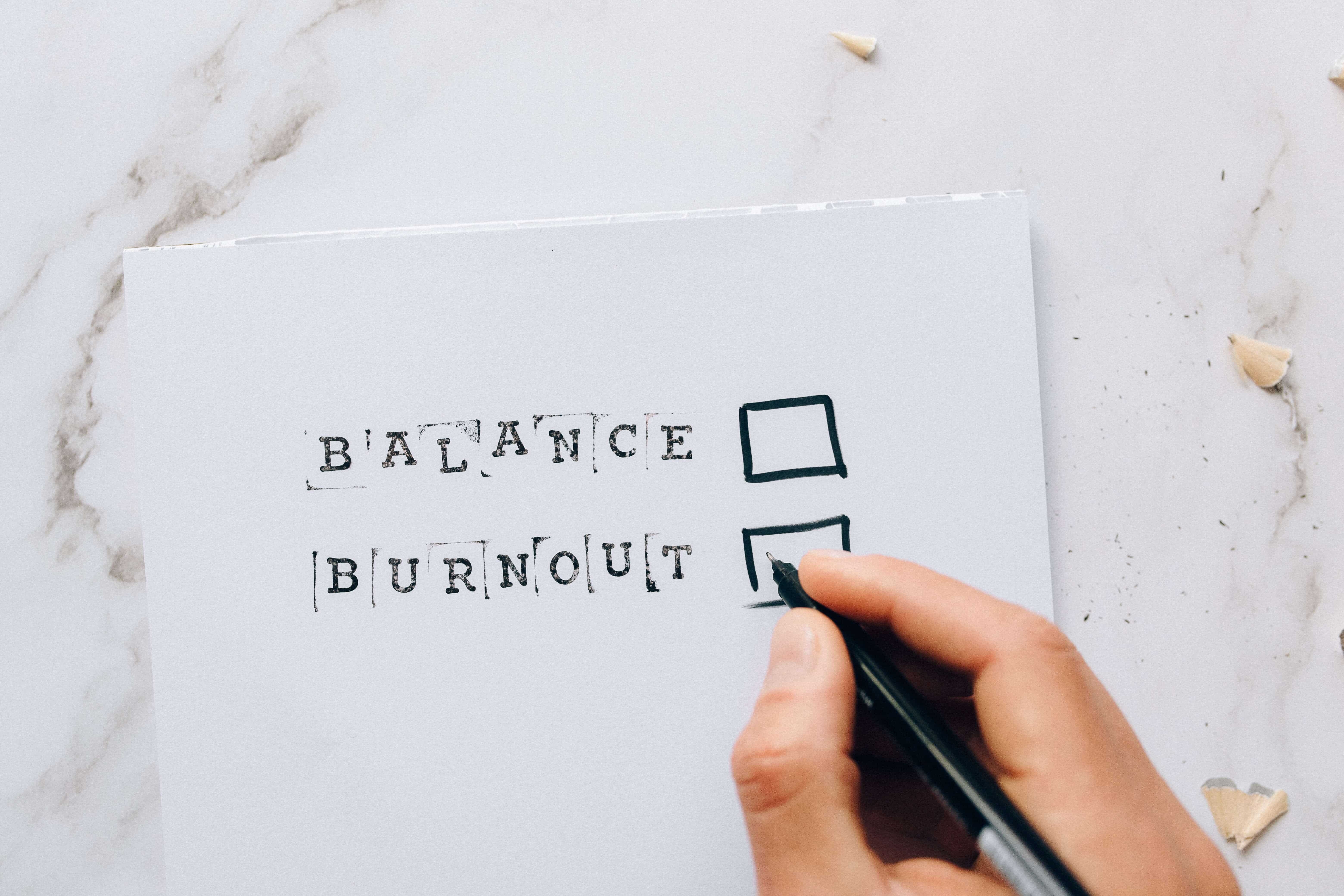 balance or burnout written on paper