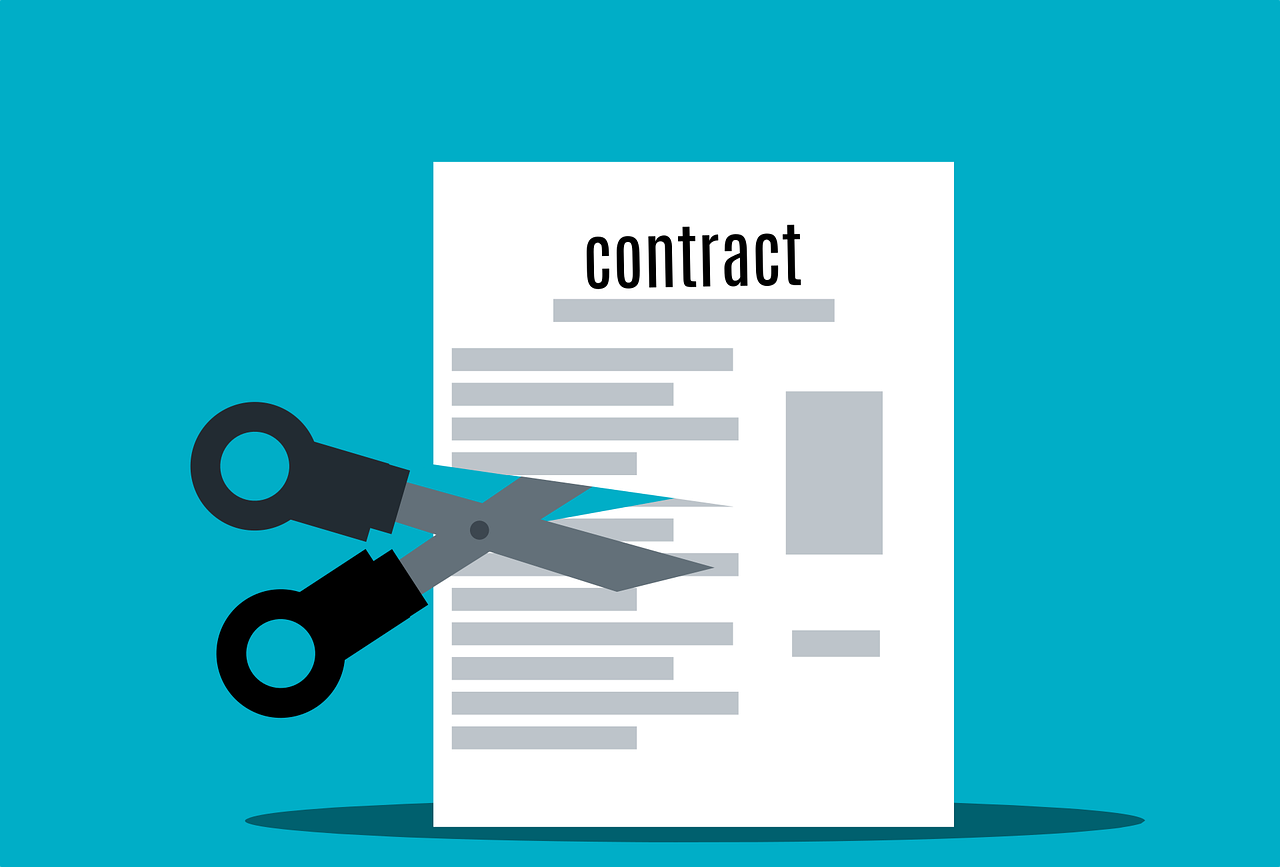 scissors cutting up a contract