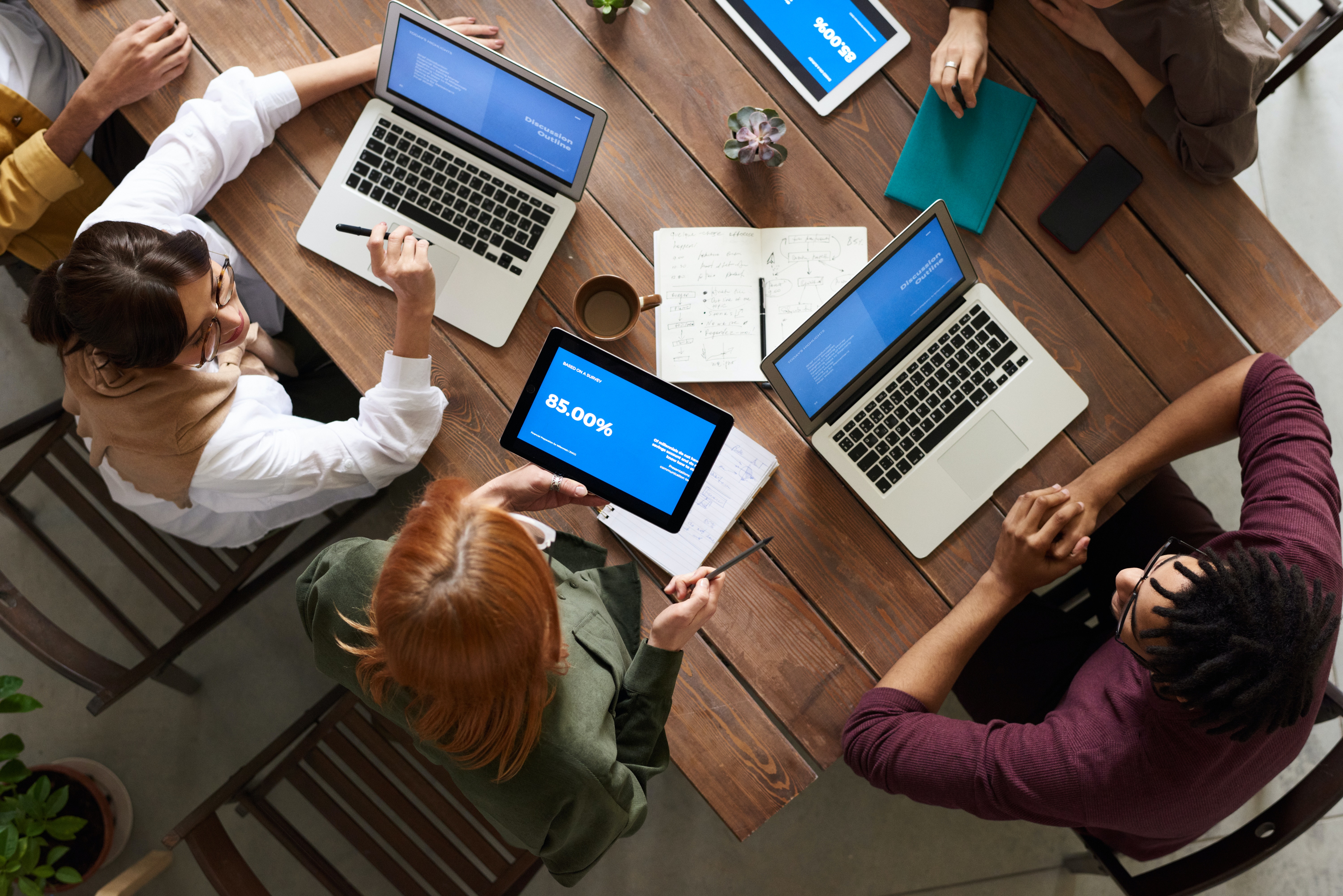Top View Photo Of Group Of People Using Laptops