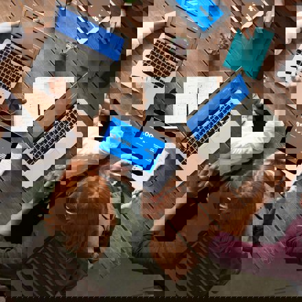 Top View Photo Of Group Of People Using Laptops