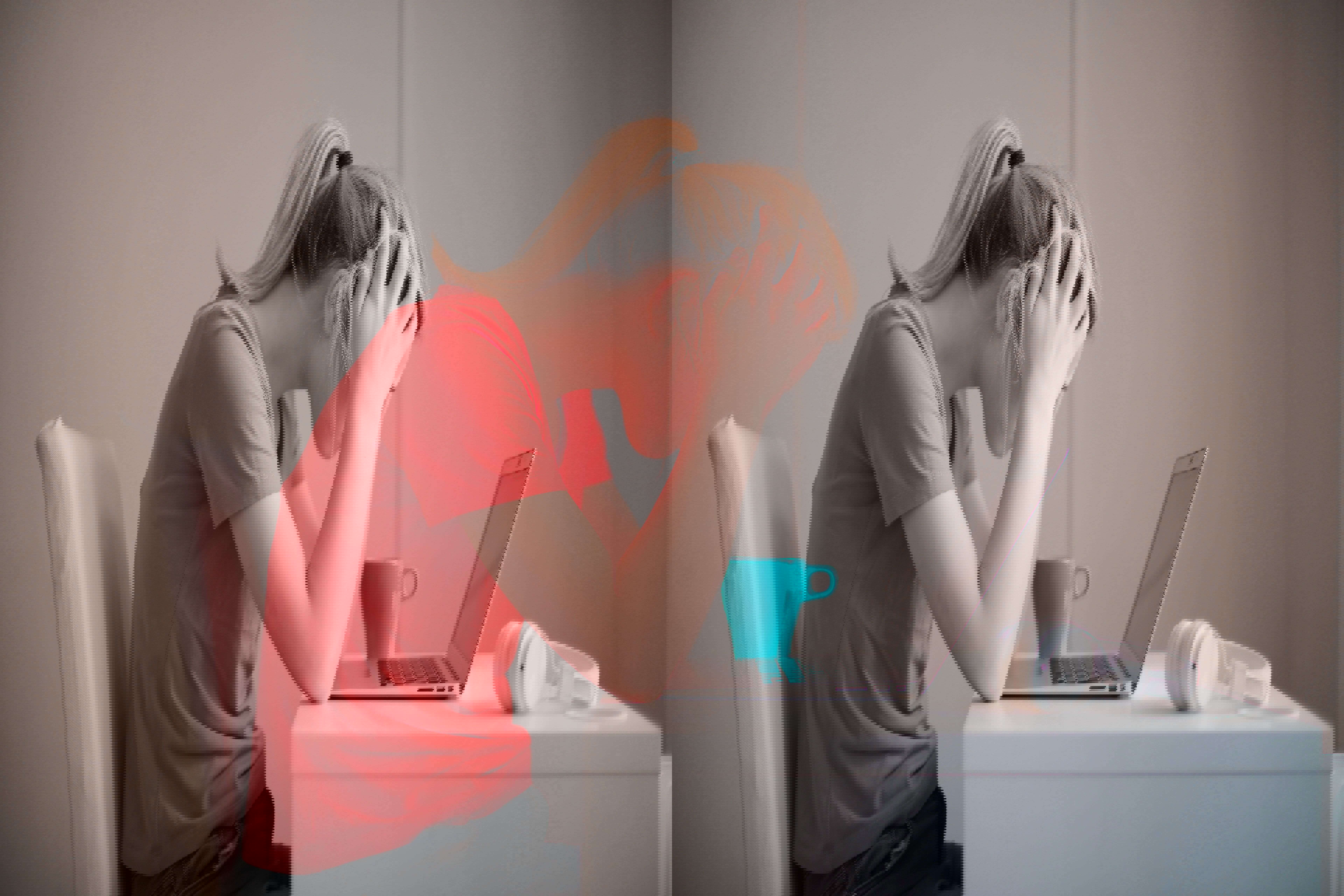 A woman stressed in front of a laptop