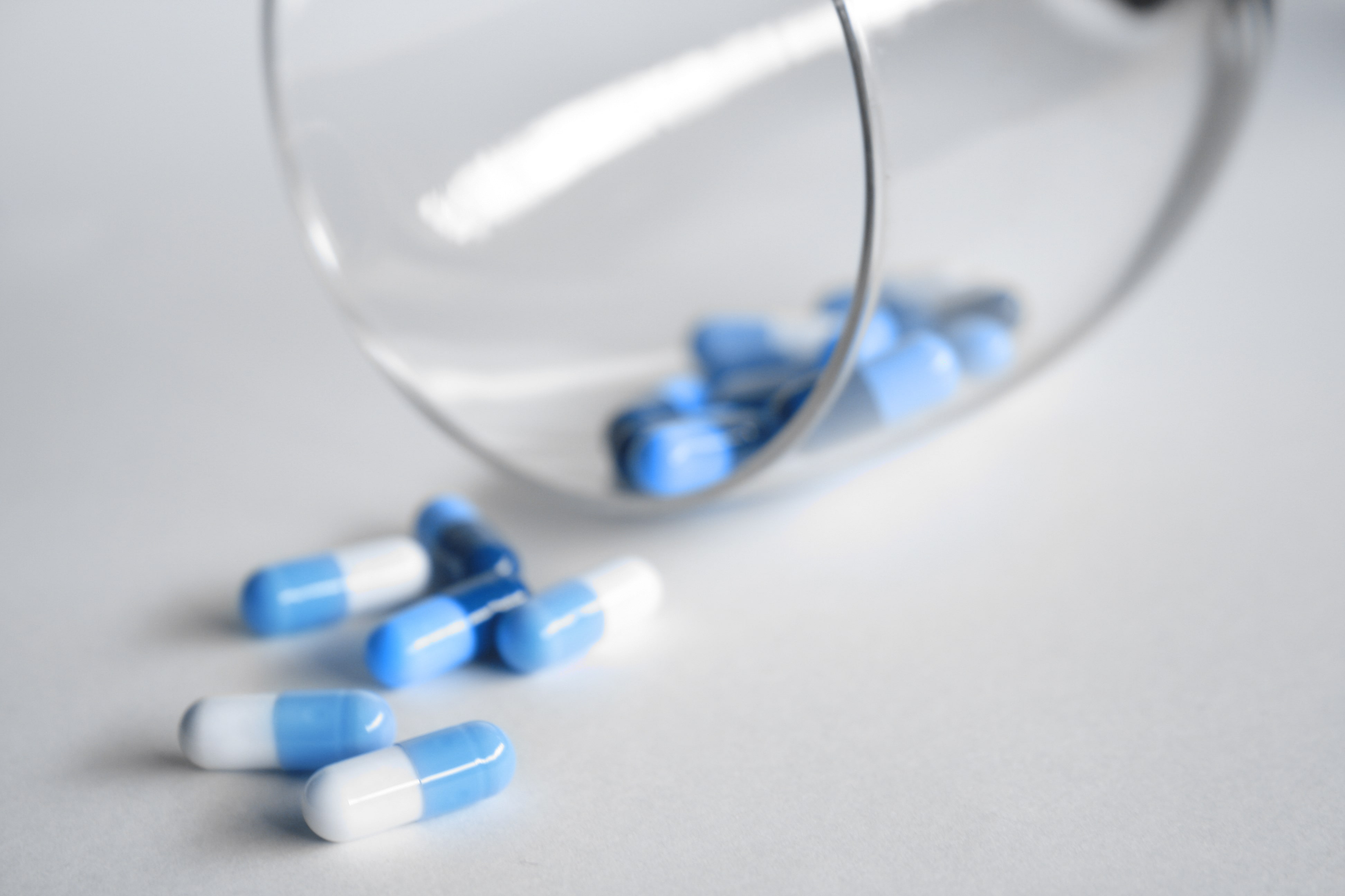 White and blue painkiller capsules